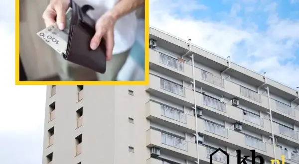 Ręce wkładają pieniądze do portfela, a w tle widać blok mieszkalny. To przypomina, co to jest czynsz.
