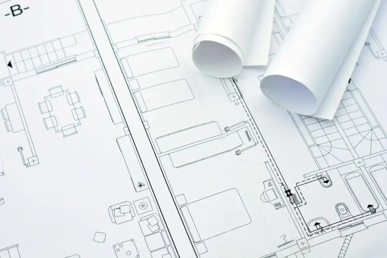 Plany architektoniczne i zrolowane dokumenty. Kluczowe dla każdego, kto chce wiedzieć, jak sprawdzić dewelopera.