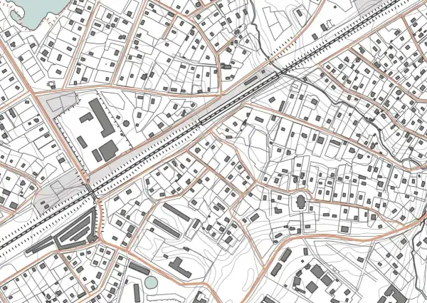 Szczegółowa mapa sytuacyjno wysokościowa z zaznaczonymi budynkami, drogami i liniami kolejowymi.